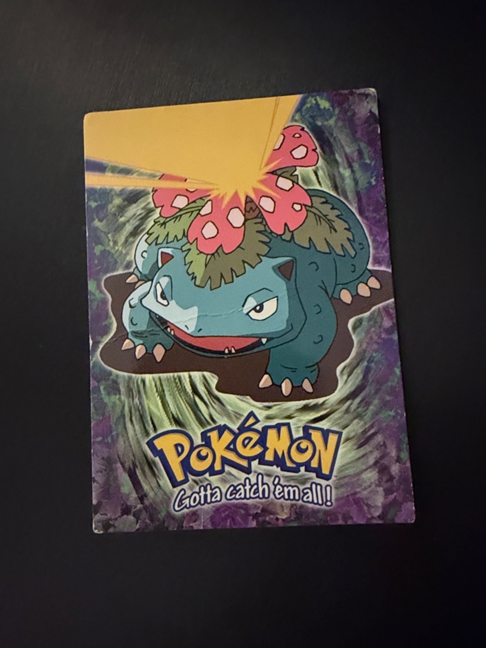 Topps Pokémon Card with Blue, Green, Pink and Yellow Artwork